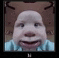 a close up of a baby 's face with a very funny face .