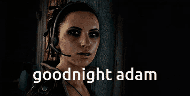 a woman wearing headphones and a microphone says " goodnight adam "