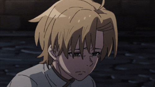 a close up of a person 's face with a sad look on his face