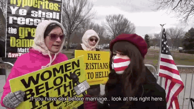 a woman wearing a mask holds a sign that says fake ristians to hell