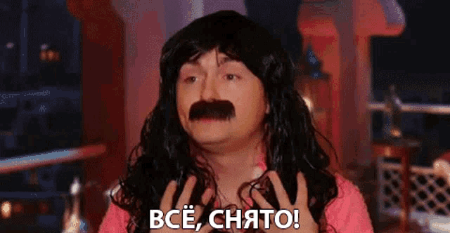 a man with long hair and a mustache is making a funny face and saying " bce , chato ! "