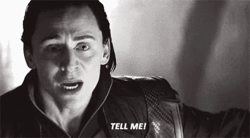 a close up of a man 's face with the words `` tell me '' written on it .
