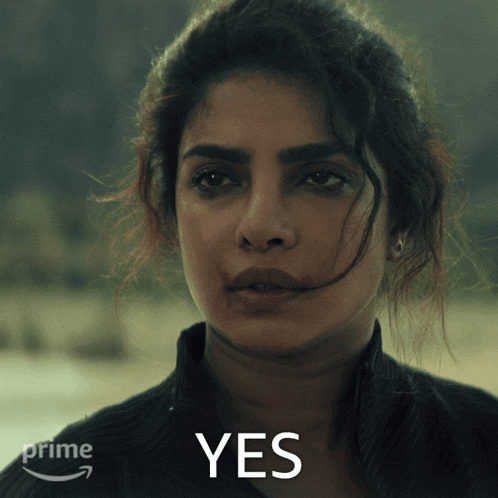 a close up of a woman 's face with the word yes in the upper right corner