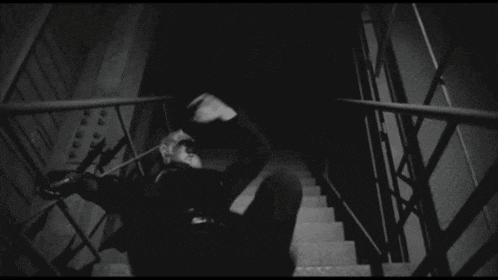 a black and white photo of a set of stairs going up