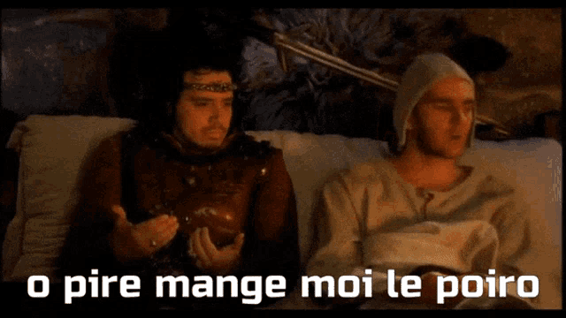 two men are sitting on a bed with the words " o pire mange moi le poiro " below them