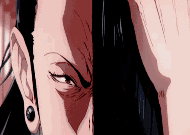 a close up of a person 's face with piercings