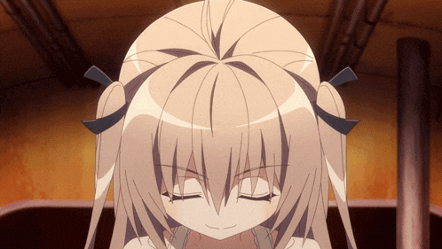 a girl with pigtails has her eyes closed