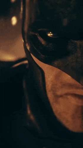a close up of a man 's face with a mask on