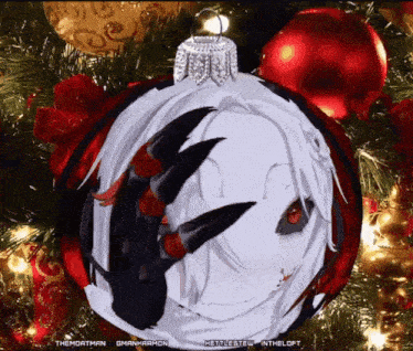 a christmas tree with a christmas ornament with a face on it