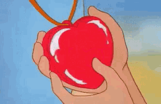 a cartoon drawing of a person holding a heart with the words ti adoro above it