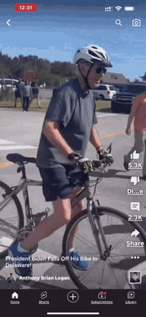 a man wearing a helmet and sunglasses is riding a bike on a road