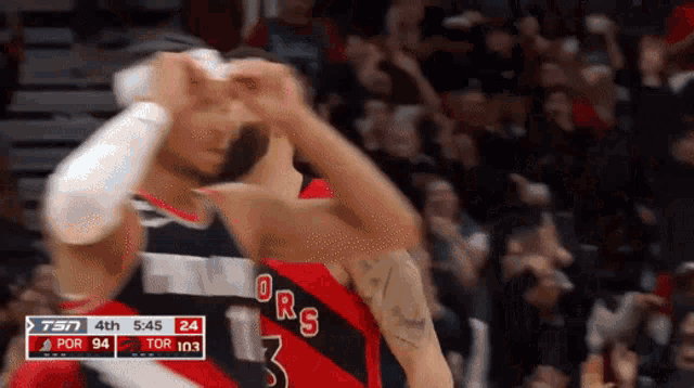 a basketball player with the number 3 on his jersey is celebrating