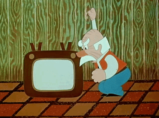 a cartoon character is kneeling down in front of a tv