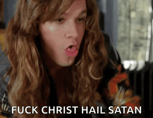 a man with long hair says " fuck christ hail satan " in front of him