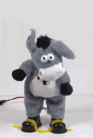 a stuffed donkey with a leash around its neck dancing