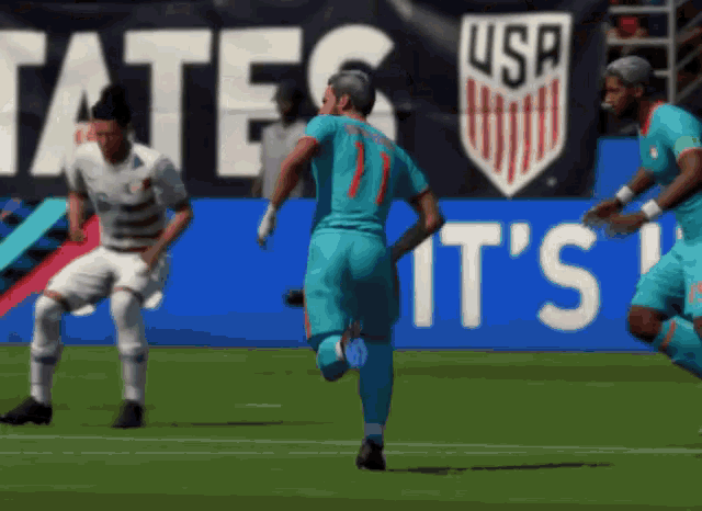 a soccer game is being played in front of a sign that says usa