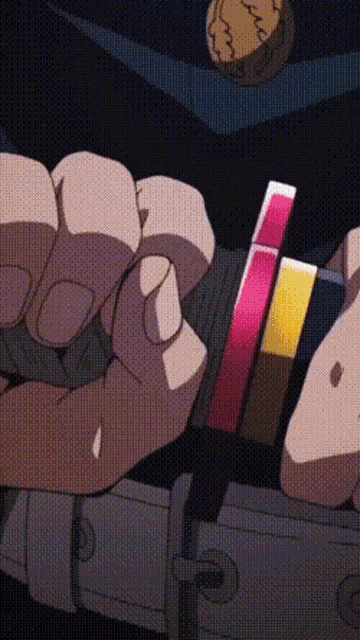 a close up of a person 's hand holding a bracelet with lipstick on it .