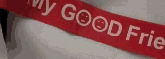 a red ribbon with the words `` my good friend '' on it .