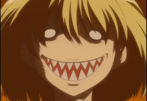 a close up of a person 's face with a shark teeth smile