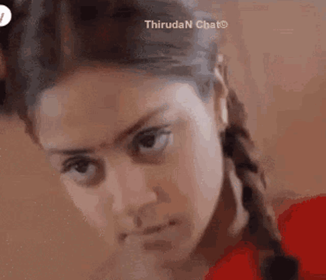 a close up of a woman 's face with the words thiruda n chat written on the bottom