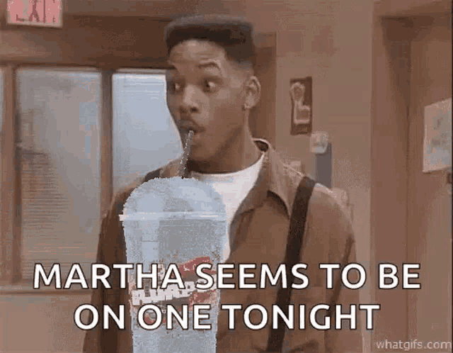 a man is drinking a milkshake with a straw and says `` martha seems to be on one tonight ''