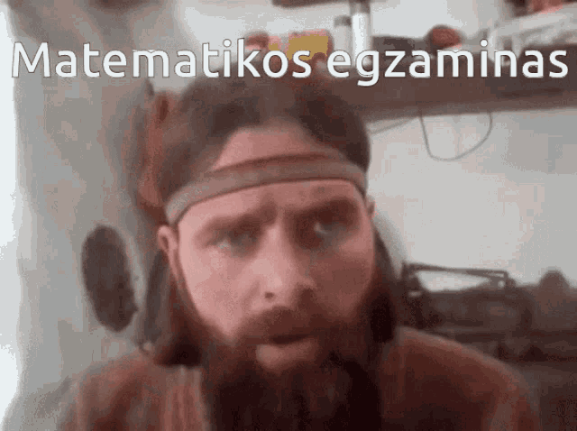 a man with a beard is wearing a headband with the words matematikos egzaminas written on it