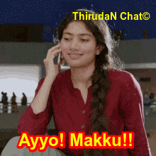 a woman in a red shirt is talking on a cell phone with the words ayyo makku written below her
