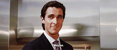 a man in a suit and tie is smiling and says maybe