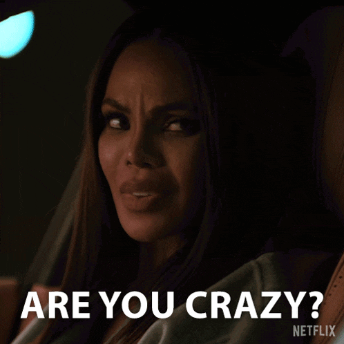 a woman sitting in a car with the words " are you crazy " on the bottom