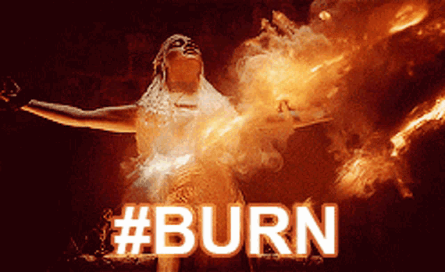 a woman in a white dress is surrounded by flames and the word burn
