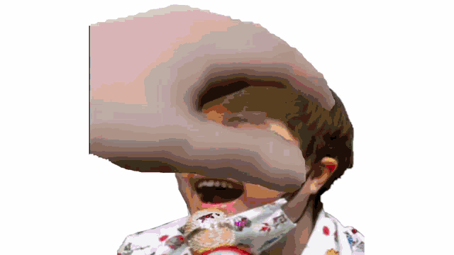 a hand is reaching into a child 's mouth while the child is wearing a face mask