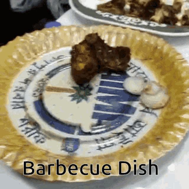 a paper plate with food on it and the words barbecue dish written on it