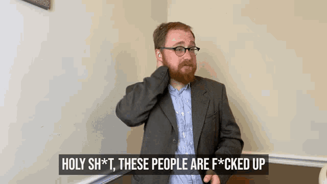a man in a suit says holy shit these people are f*cked up