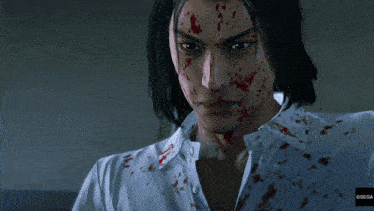 a man with blood on his face is wearing a white shirt that says sega on the bottom