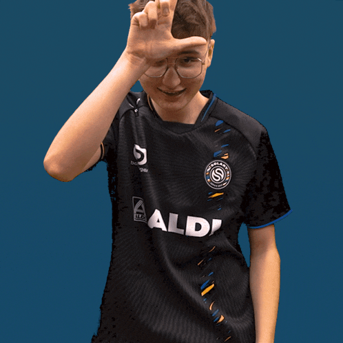a boy wearing a black shirt with aldi on it