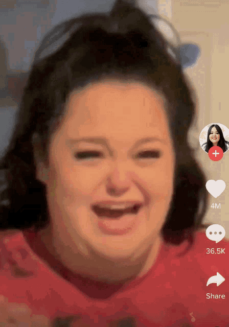 a woman 's face is shown on a tiktok video with a heart and share button