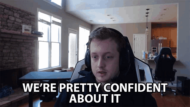 a man wearing headphones says " we 're pretty confident about it " in a living room
