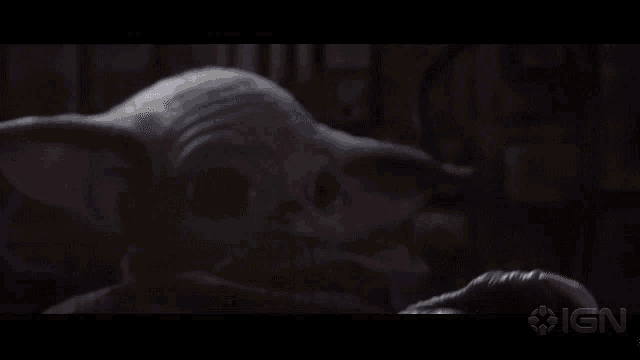 a close up of a baby yoda with a ign logo in the corner