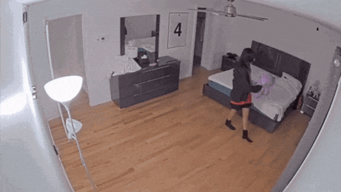 a bedroom with a ceiling fan and a sign that says 4
