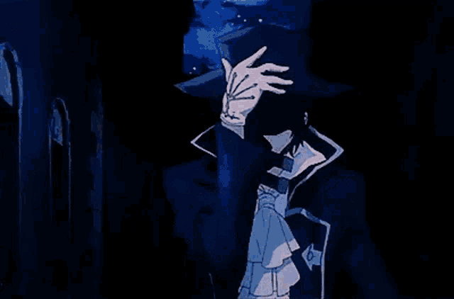 a man in a blue suit and tie is standing in a dark room .