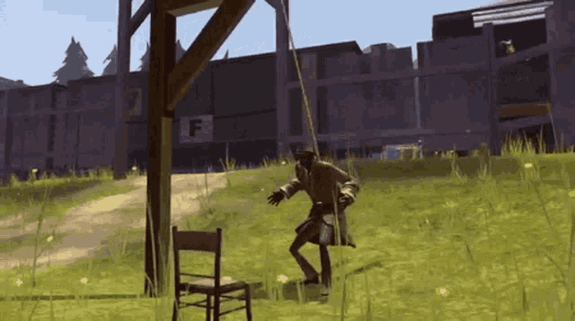 a man is swinging from a rope in front of a building that has the letter f on it