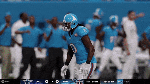 a football player in a blue jersey with the number 0 on it