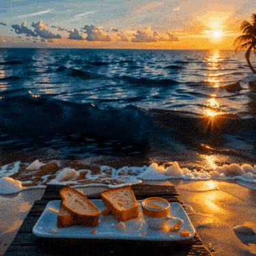 two slices of bread and a cup of coffee on a tray on the beach at sunset