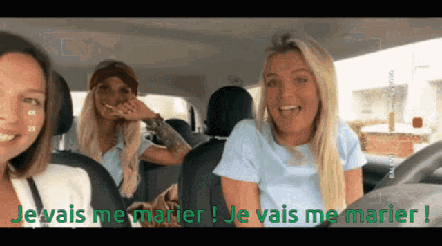 three women are in a car with the words je vais me marier