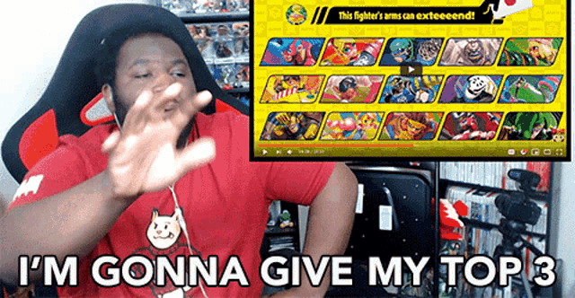 a man sitting in front of a screen that says ' i 'm gonna give my top 3 '