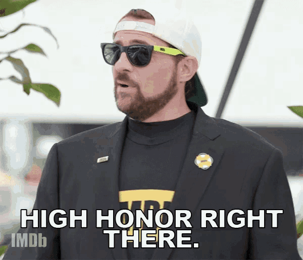 a man in a suit and sunglasses says high honor right there .