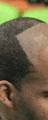 a close up of a person 's head with a shaved line in it .