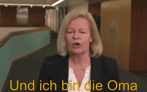 a woman says " und ich bin die oma " in front of her face