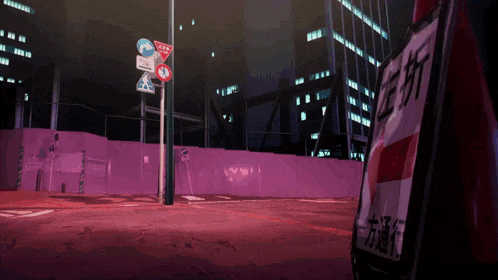 a purple fence surrounds a street with a sign that says ' a ' on it