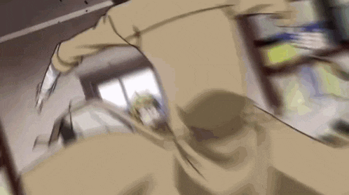 a man in a trench coat is walking in a room .